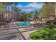 Community pool and lounge area featuring palm trees, lounge chairs, and resort style ammenities at 108 Lemon Glaze St # 202, Las Vegas, NV 89145