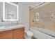 Bright bathroom featuring a shower-over-tub, lighted mirror, and a single sink at 11099 Moonlight Fire Ct, Las Vegas, NV 89135