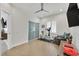 Bright exercise room boasts a stationary bike, plush seating, and modern fixtures at 11099 Moonlight Fire Ct, Las Vegas, NV 89135