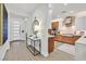 Elegant foyer leading to a modern kitchen with custom cabinetry and stainless steel appliances at 11099 Moonlight Fire Ct, Las Vegas, NV 89135