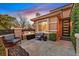 Cozy front porch with seating, a modern door, and well-maintained landscaping, offering curb appeal at 11099 Moonlight Fire Ct, Las Vegas, NV 89135