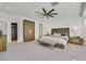 Bright main bedroom with a large wardrobe and a comfortable seating area at 11099 Moonlight Fire Ct, Las Vegas, NV 89135