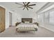 Spacious main bedroom with a ceiling fan, plantation shutters, and neutral decor at 11099 Moonlight Fire Ct, Las Vegas, NV 89135