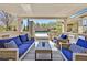 Enjoy this cozy outdoor space complete with comfortable seating, a built-in grill and pool views at 11099 Moonlight Fire Ct, Las Vegas, NV 89135