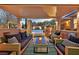 Inviting outdoor living space featuring wicker furniture, a built-in grill, and a refreshing pool view at 11099 Moonlight Fire Ct, Las Vegas, NV 89135
