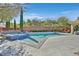 Beautiful pool with a jacuzzi, stone trim, and brick walls at 11099 Moonlight Fire Ct, Las Vegas, NV 89135
