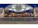 Upscale shopping center featuring a variety of storefronts and restaurants at night at 11099 Moonlight Fire Ct, Las Vegas, NV 89135