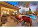 Gorgeous backyard pool and patio area with comfortable lounge chairs, ideal for relaxation and outdoor enjoyment at 11099 Moonlight Fire Ct, Las Vegas, NV 89135
