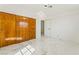 Bedroom featuring marble floors, warm lighting, and sliding closet doors at 1300 Oak Tree Ln, Las Vegas, NV 89108