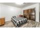 Bedroom featuring wood floors, sliding closet doors, and decorative furnishings at 1300 Oak Tree Ln, Las Vegas, NV 89108