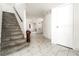 Bright entryway features marble floors, stairs, a hallway, and an arched entrance at 1300 Oak Tree Ln, Las Vegas, NV 89108