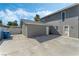 Exterior view with a large parking area, shed, and access door at 1300 Oak Tree Ln, Las Vegas, NV 89108