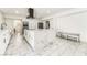 Spacious kitchen with modern marble island, stainless steel appliances, and ample cabinet space at 1300 Oak Tree Ln, Las Vegas, NV 89108