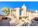 Charming two-story home featuring stucco siding, a red tile roof, and a spacious backyard with desert landscaping at 1308 Capri Dr # D, Boulder City, NV 89005
