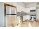 Contemporary kitchen with stainless steel appliances, white cabinetry, and stylish backsplash at 1308 Capri Dr # D, Boulder City, NV 89005