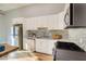 Updated kitchen featuring stainless steel appliances, white cabinets, and modern countertops at 1308 Capri Dr # D, Boulder City, NV 89005
