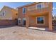 Backyard of this home boasts an exterior patio, sliding glass door and rock landscaping at 1416 Swanbrooke Dr, Las Vegas, NV 89144