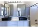 The bathroom has dual sinks with dark fixtures and tub/shower combo at 1416 Swanbrooke Dr, Las Vegas, NV 89144
