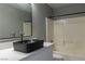 This bathroom features a black basin sink with a tub/shower combo at 1416 Swanbrooke Dr, Las Vegas, NV 89144
