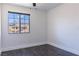 This bedroom features a window with a view of the neighborhood and mountains at 1416 Swanbrooke Dr, Las Vegas, NV 89144
