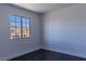 Clean bedroom boasts a large window offering neighborhood views and neutral walls at 1416 Swanbrooke Dr, Las Vegas, NV 89144