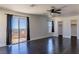 Large bedroom with dark wood flooring, large windows and a sliding glass door at 1416 Swanbrooke Dr, Las Vegas, NV 89144