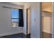 This bedroom has hardwood floors and a window with a view of the city at 1416 Swanbrooke Dr, Las Vegas, NV 89144