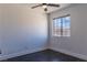 This bedroom features a ceiling fan and a window with a view of the neighborhood at 1416 Swanbrooke Dr, Las Vegas, NV 89144