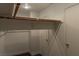 This is a closet with a light and wood bar for hanging items at 1416 Swanbrooke Dr, Las Vegas, NV 89144