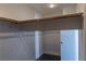 This is a closet with a light and wood bar for hanging items at 1416 Swanbrooke Dr, Las Vegas, NV 89144