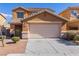 Charming two-story home featuring a two-car garage and low maintenance landscaping at 1416 Swanbrooke Dr, Las Vegas, NV 89144