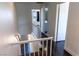 Hallway featuring staircase, dark wood flooring, and crisp white walls at 1416 Swanbrooke Dr, Las Vegas, NV 89144