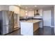 Stylish kitchen featuring stainless steel appliances, an island, and white cabinets at 1416 Swanbrooke Dr, Las Vegas, NV 89144