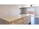 Close-up of the kitchen island, with stone countertop and plenty of storage space at 1416 Swanbrooke Dr, Las Vegas, NV 89144