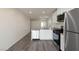 Modern kitchen with stainless steel appliances, white cabinets, and an open layout for seamless entertaining at 1716 Desert Path Ave, North Las Vegas, NV 89032