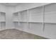 Walk-in closet featuring ample shelving and multiple rods for organized storage at 2325 Janesville Ln, Henderson, NV 89044