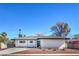 Charming single-story home featuring a well-maintained front yard, desert landscaping, and a dark gray roof at 2605 Amarillo St, Las Vegas, NV 89102