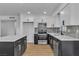 Bright kitchen features white cabinets, stainless steel appliances, an island with a white countertop, and tiled backsplash at 2605 Amarillo St, Las Vegas, NV 89102