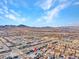 Aerial view of a large neighborhood community with a backdrop of mountains at 3004 Barrett Springs Ave, Henderson, NV 89044