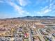 Aerial view of a neighborhood with mountain views and desert landscape at 3004 Barrett Springs Ave, Henderson, NV 89044