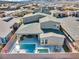 Aerial view of backyard with pool, spa, covered patio, and desert landscaping at 3004 Barrett Springs Ave, Henderson, NV 89044