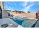 The backyard features a pool with a waterfall feature and a serene, private setting at 3004 Barrett Springs Ave, Henderson, NV 89044