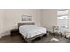 Minimalist bedroom with a platform bed, neutral decor, and wood floors at 3004 Barrett Springs Ave, Henderson, NV 89044