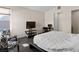 Bedroom featuring a large bed, seating area, and neutral color scheme at 3004 Barrett Springs Ave, Henderson, NV 89044