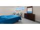 This bedroom features carpeted floors, large windows, and a dark wooden dresser at 3004 Barrett Springs Ave, Henderson, NV 89044