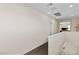 Well-lit second floor hallway with dark floors and a view into an exercise room at 3004 Barrett Springs Ave, Henderson, NV 89044