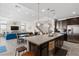 Spacious kitchen with a large island, adjacent to the dining area and cozy living room at 3004 Barrett Springs Ave, Henderson, NV 89044
