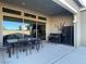 Covered patio with an outdoor dining area, a bar, and a built-in refrigerator for entertaining at 3004 Barrett Springs Ave, Henderson, NV 89044