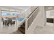 Staircase with backyard view, providing a glimpse of the outdoor dining and patio furniture at 3004 Barrett Springs Ave, Henderson, NV 89044
