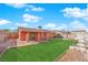 Spacious backyard with a well-maintained lawn, providing ample space for outdoor activities and gatherings at 3920 Geist Ave, Las Vegas, NV 89115